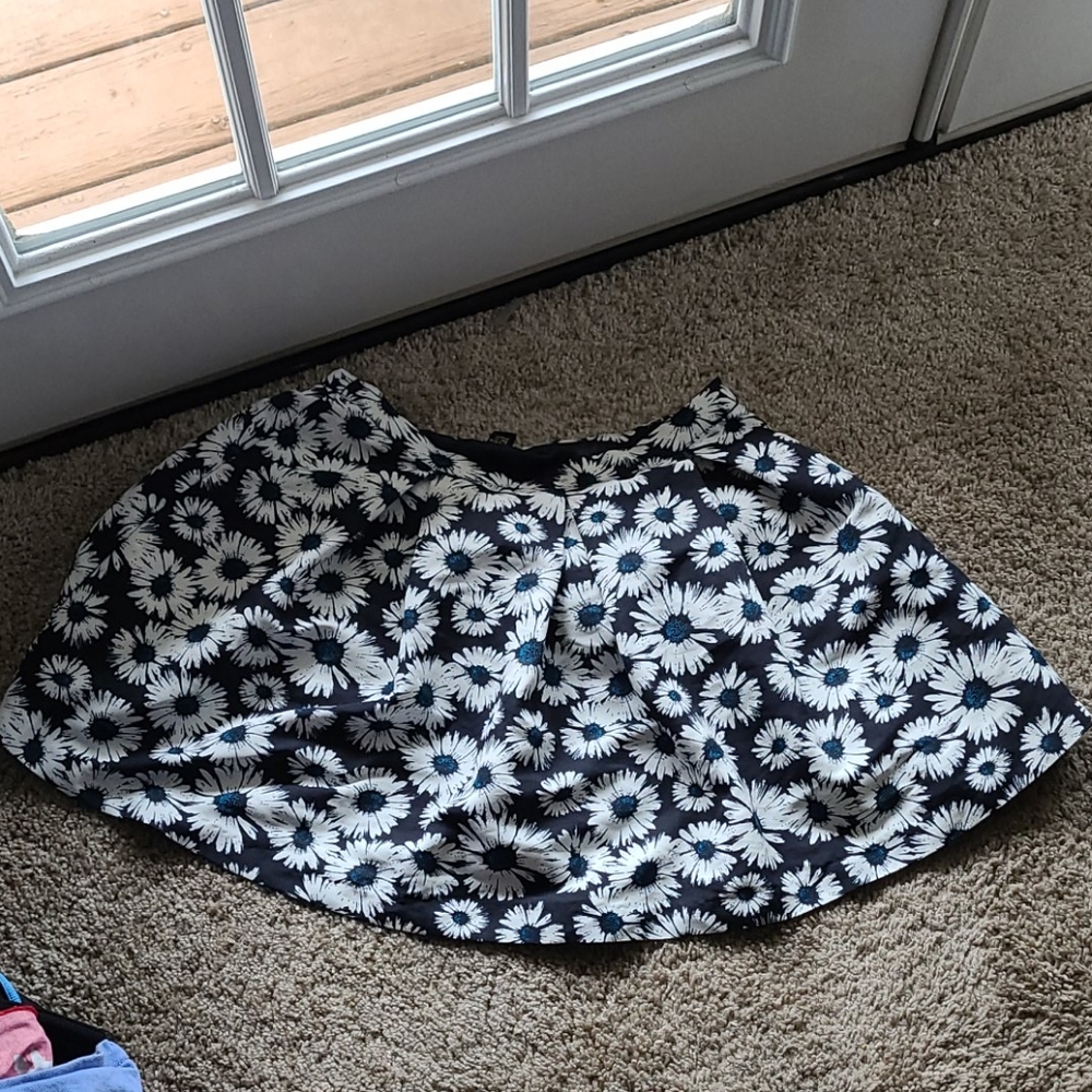 Flowery short slightly skirt. Poofy.